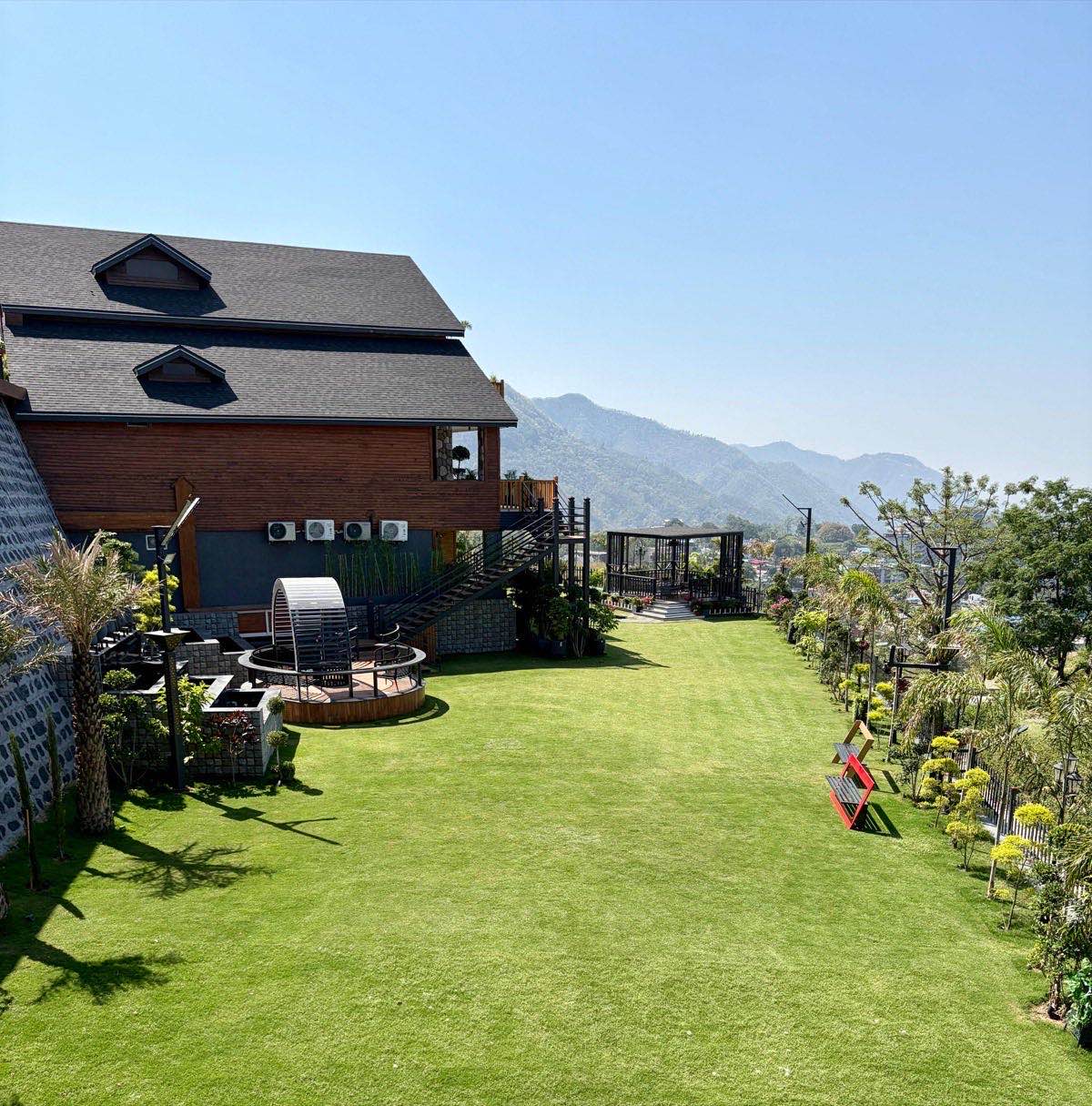 Hillcrest villa with expansive manicured lawn and Shivalik mountain views in Dehradun