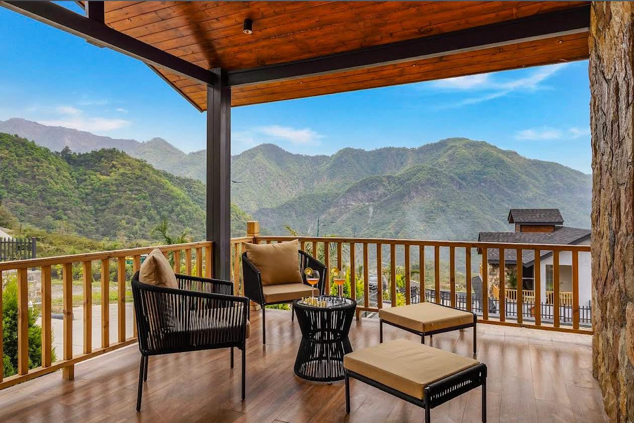 Private deck with seating overlooking Shivalik mountains by day